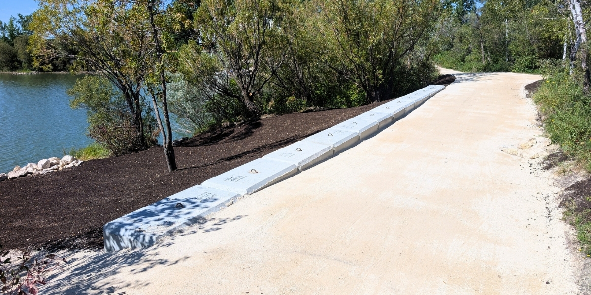A repaired trail section with a concrete section on the left