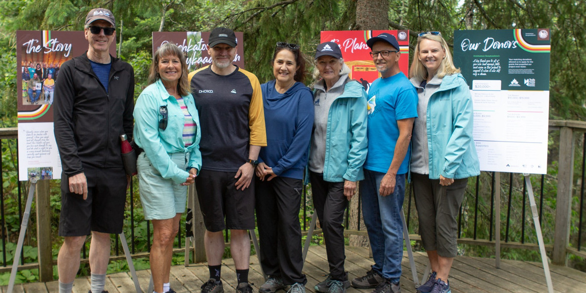 00Feature image_Onishkatoon opening_credit Keely Middleton kbphoto | Trans Canada Trail group of people posing infront of trail signage in forest